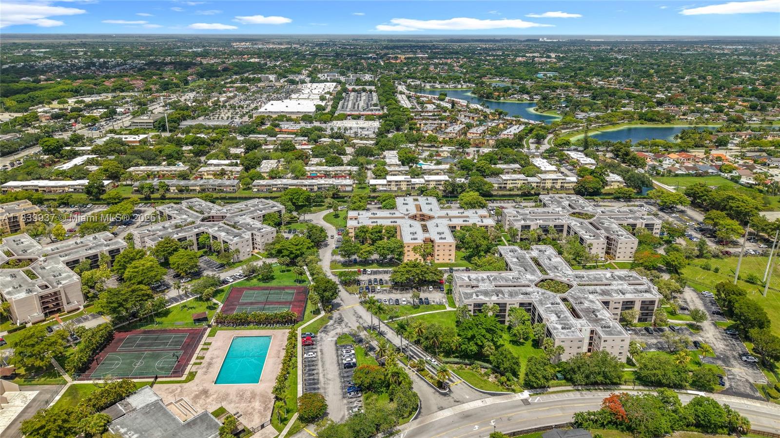an aerial view of residential houses with city view