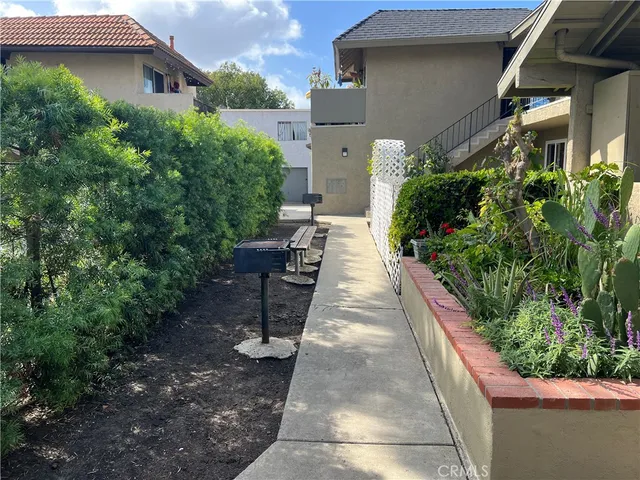 a view of a backyard with potted plants