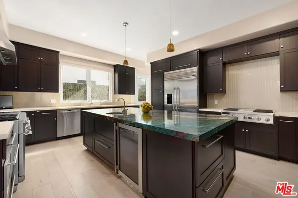a kitchen with lots of counter space and a sink