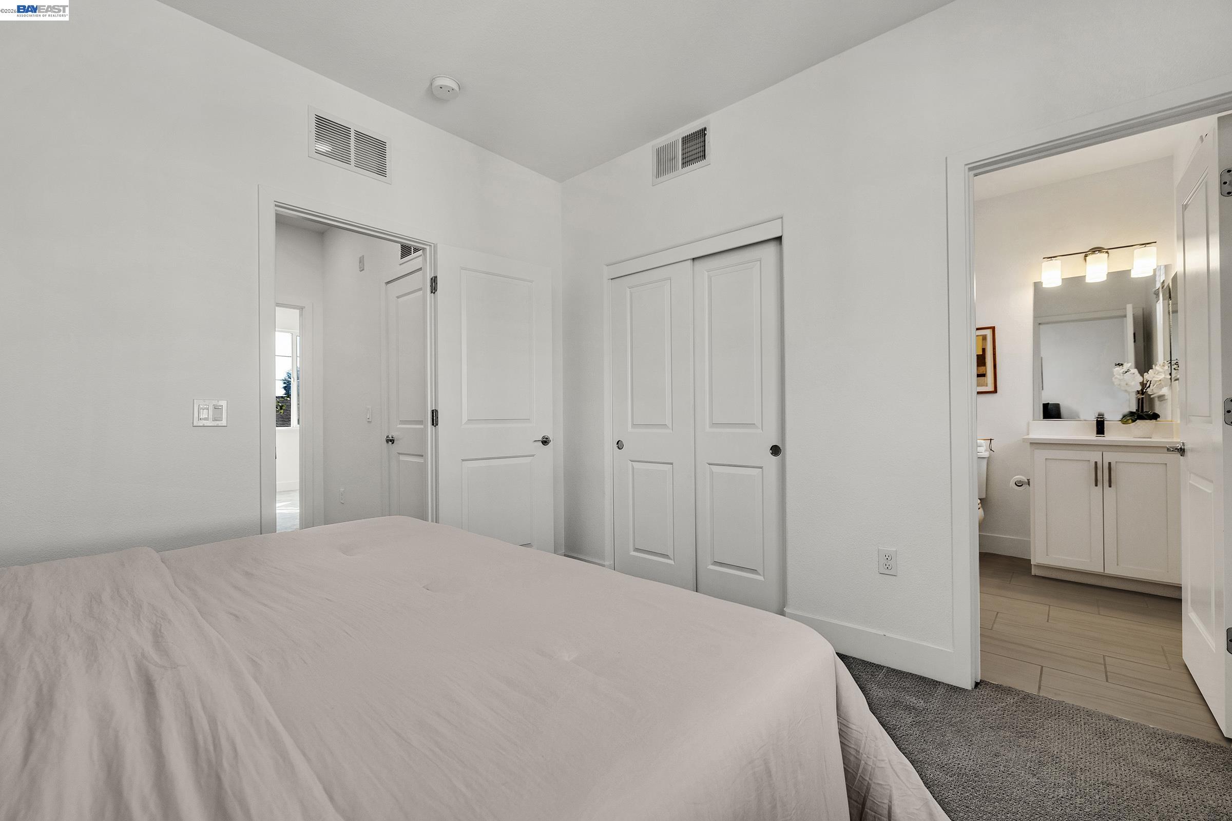 29259 Hub Court Hayward, CA 94544 - Photo 22 of 34 a spacious bedroom with a bed and a view of bathroom
