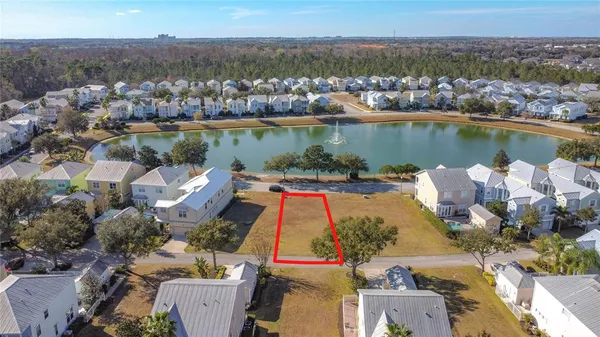 an aerial view of a house with a lake view
