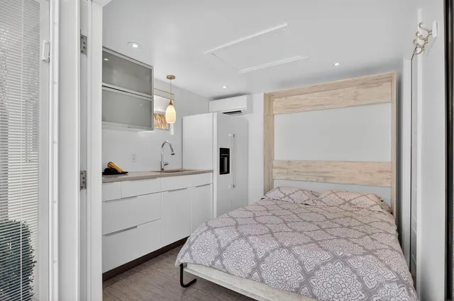 a spacious bathroom with a double vanity sink and a mirror
