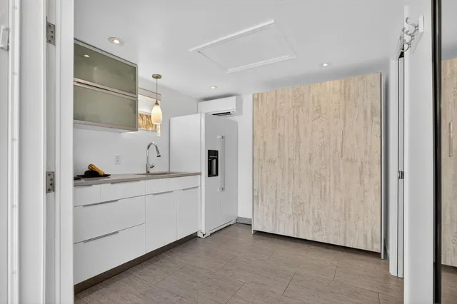 a bathroom with a sink a mirror and a shower