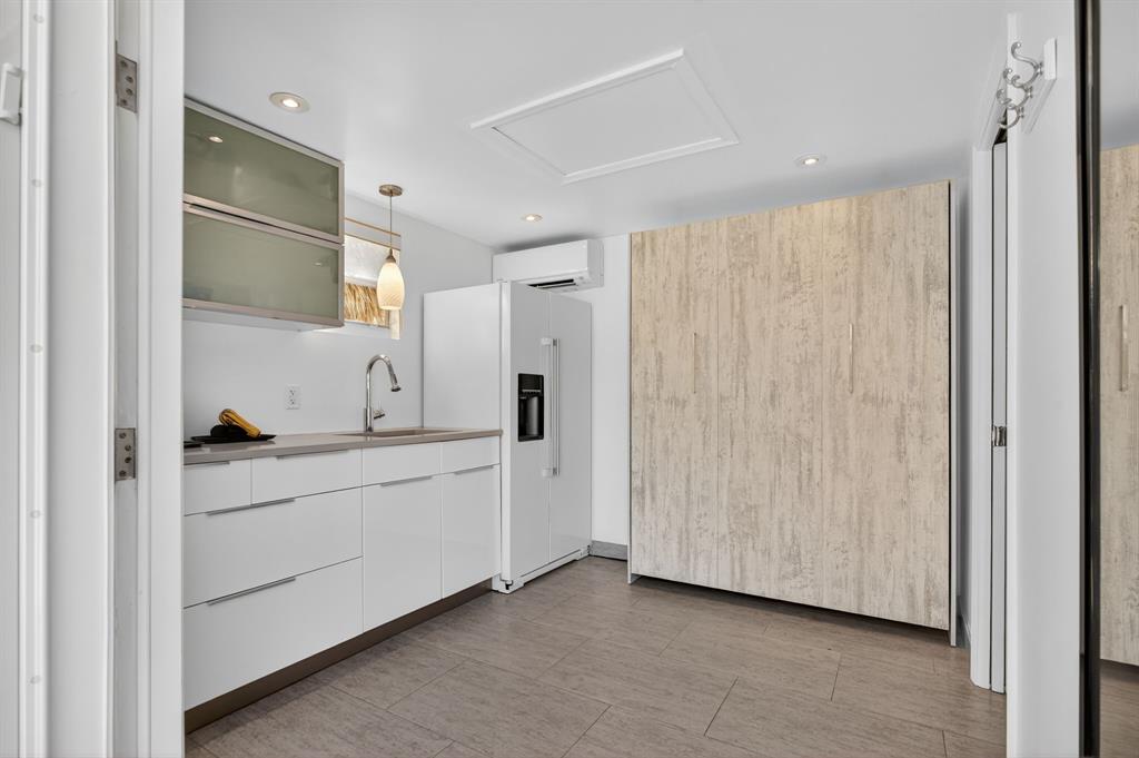 6 South Cortez Drive, Unit 6 Margate, FL 33068 - Photo 16 of 34 a spacious bathroom with a double vanity sink and a mirror