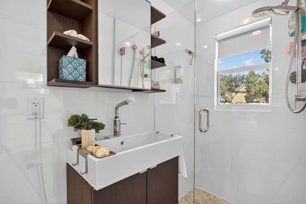 6 South Cortez Drive, Unit 6 Margate, FL 33068 - Photo 17 of 34 a bathroom with a sink a mirror and a shower