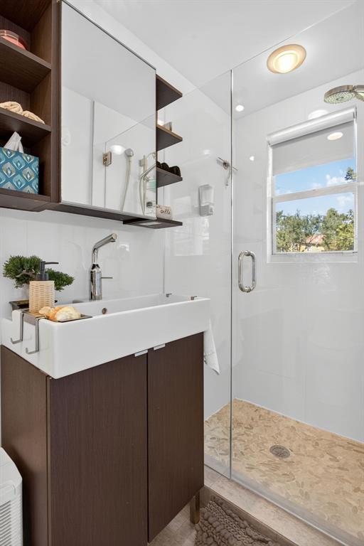 6 South Cortez Drive, Unit 6 Margate, FL 33068 - Photo 18 of 34 a bathroom with a sink and a mirror