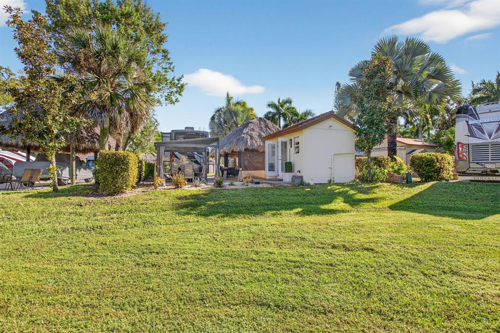 6 South Cortez Drive, Unit 6 Margate, FL 33068 - Photo 23 of 34 a view of a house with a yard