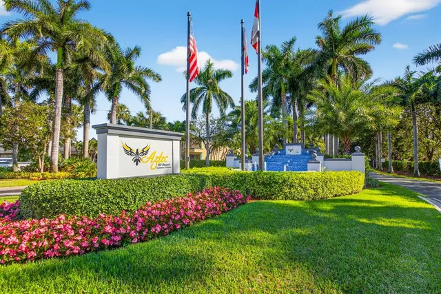 a view of a street with a cars parked in front of it