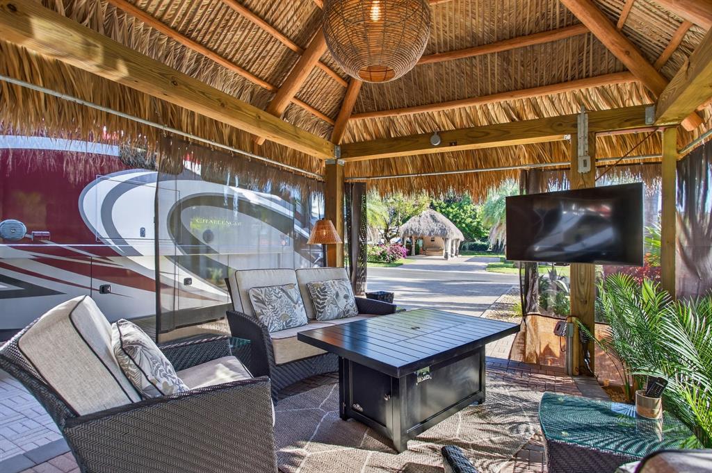 6 South Cortez Drive, Unit 6 Margate, FL 33068 - Photo 8 of 34 a wooden bench sitting in front of a building