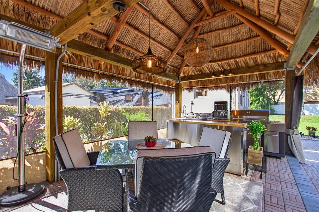 6 South Cortez Drive, Unit 6 Margate, FL 33068 - Photo 9 of 34 a view of a patio with table and chairs