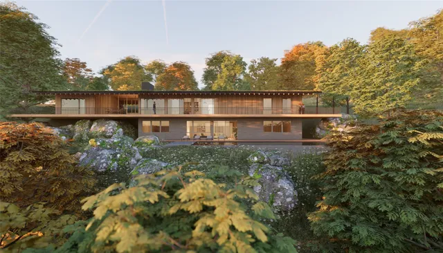 a view of a house with a yard and sitting area