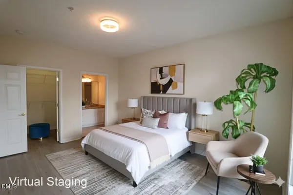 a bedroom with a bed and a couch