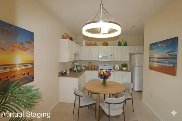 a view of a dining room with a table and chairs