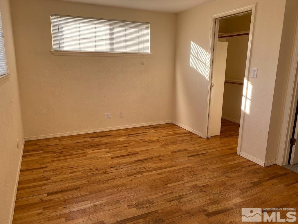 2255 Ward Place Reno, NV 89503 - Photo 7 of 13 an empty room with wooden floor and windows