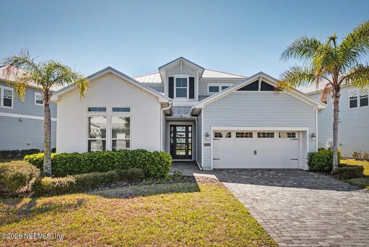 282 Caribbean Place St. Johns, FL 32259 - Photo 1 of 56 a view of a house with a yard and potted plants