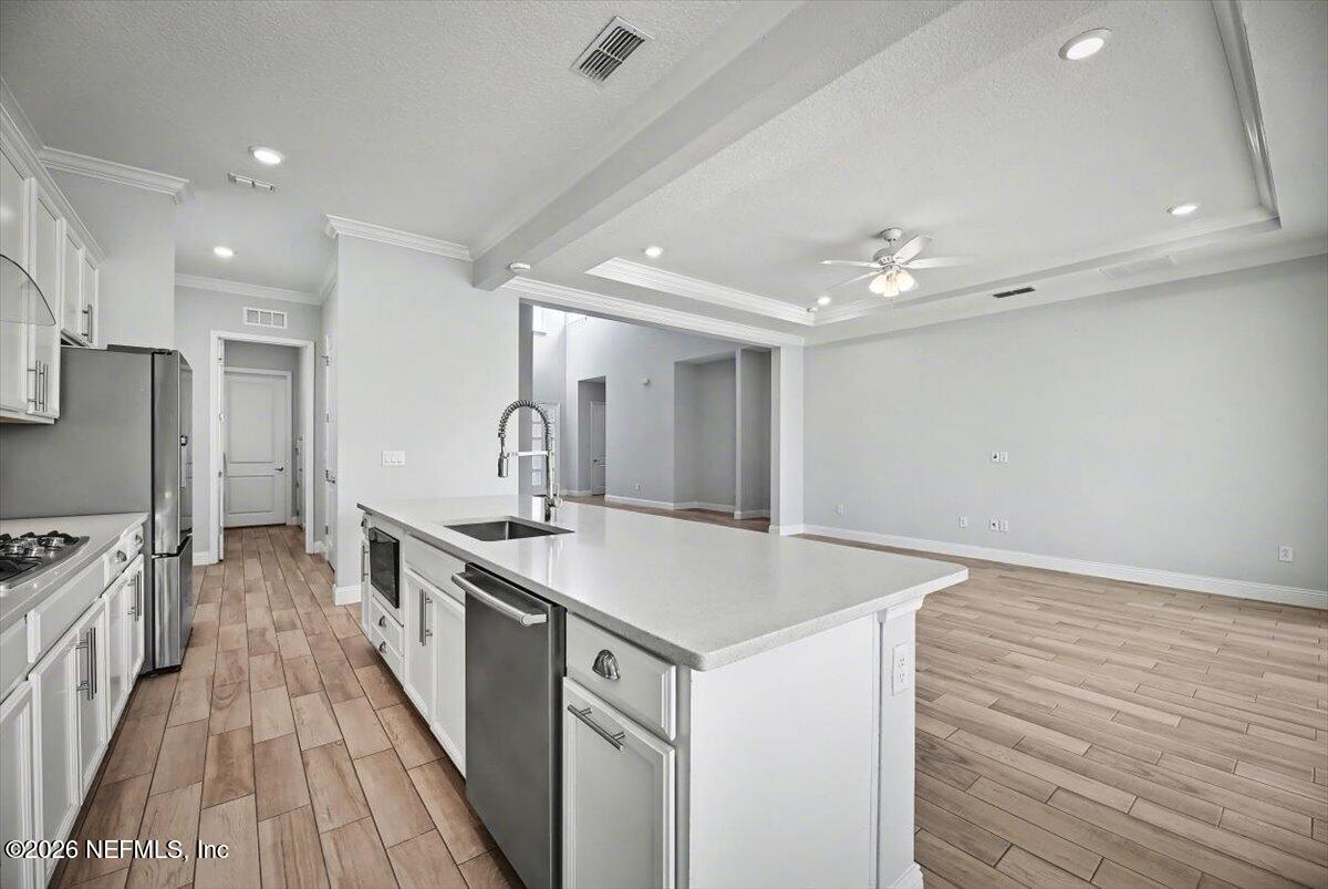 282 Caribbean Place St. Johns, FL 32259 - Photo 15 of 56 a kitchen with a sink and stainless steel appliances