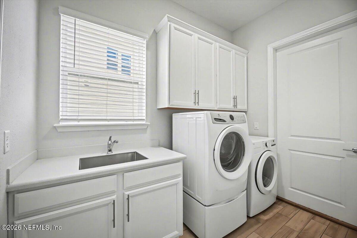 282 Caribbean Place St. Johns, FL 32259 - Photo 20 of 56 a utility room with dryer and washer