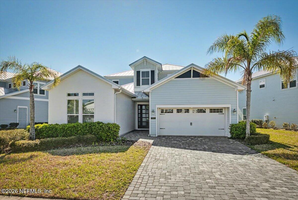 282 Caribbean Place St. Johns, FL 32259 - Photo 2 of 56 a view of a grey house with a yard