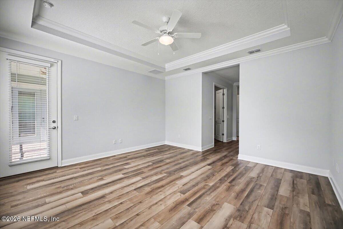 282 Caribbean Place St. Johns, FL 32259 - Photo 23 of 56 wooden floor in an empty room with a window