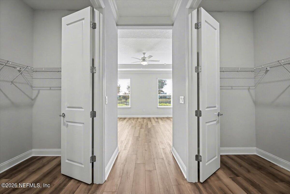 282 Caribbean Place St. Johns, FL 32259 - Photo 24 of 56 a view of a hallway with wooden floor and closet area