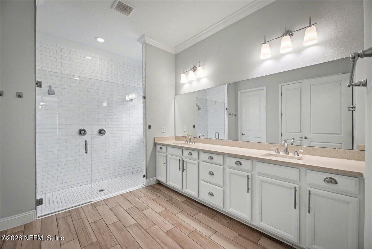 282 Caribbean Place St. Johns, FL 32259 - Photo 26 of 56 a bathroom with double sink shower and two mirror