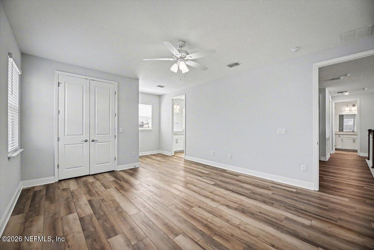 282 Caribbean Place St. Johns, FL 32259 - Photo 33 of 56 wooden floor in an empty room with a window