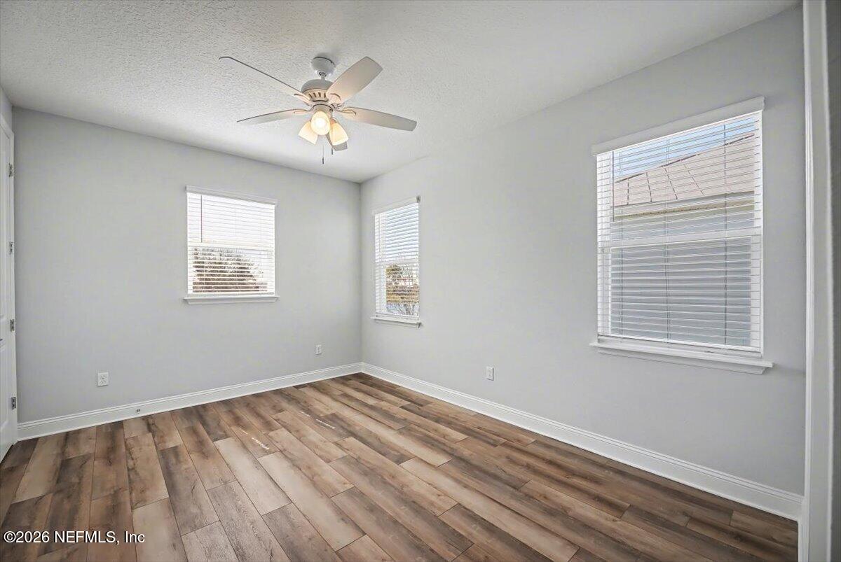 282 Caribbean Place St. Johns, FL 32259 - Photo 36 of 56 a view of an empty room with wooden floor and a window