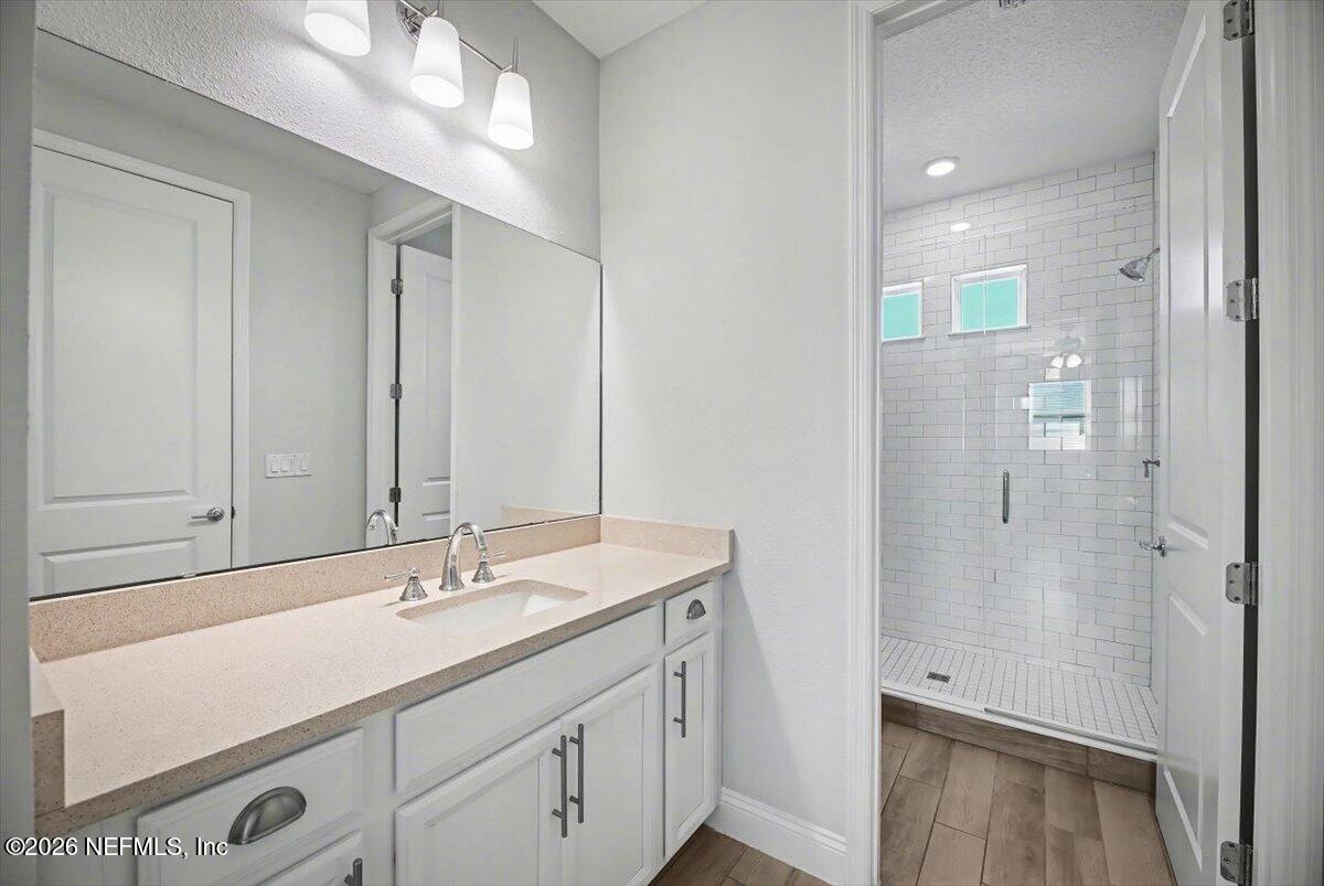 282 Caribbean Place St. Johns, FL 32259 - Photo 38 of 56 a bathroom with a sink double vanity and a mirror
