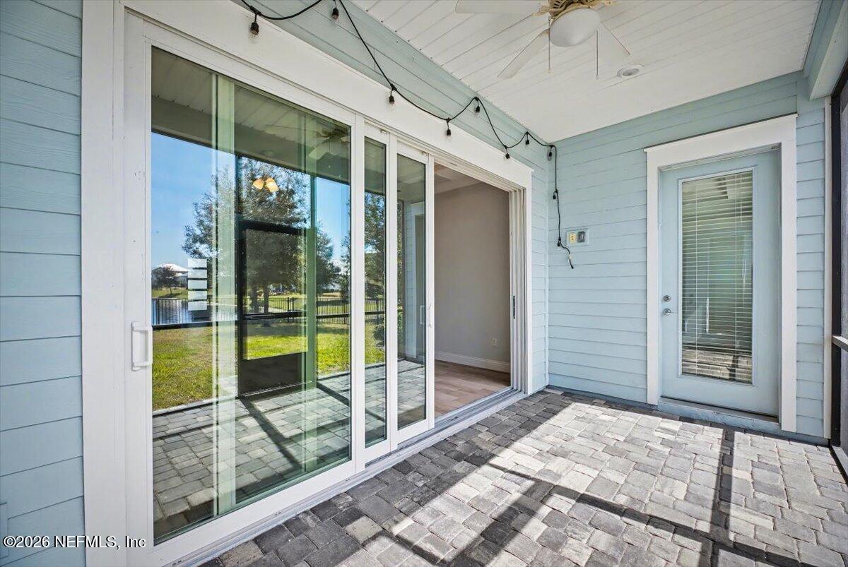 282 Caribbean Place St. Johns, FL 32259 - Photo 41 of 56 a view of a hallway with a glass door and balcony