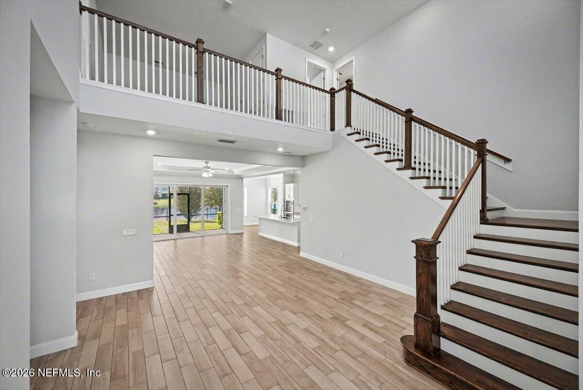 282 Caribbean Place St. Johns, FL 32259 - Photo 6 of 56 a view of staircase with white walls and window