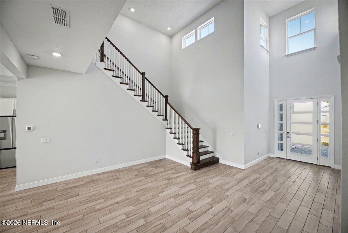 282 Caribbean Place St. Johns, FL 32259 - Photo 7 of 56 a view of entryway with wooden floor