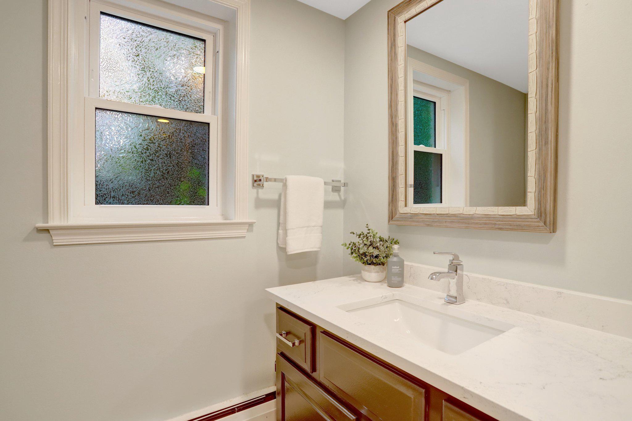 7506 Oriole Avenue Springfield, VA 22150 - Photo 47 of 67 a bathroom with a sink and a mirror