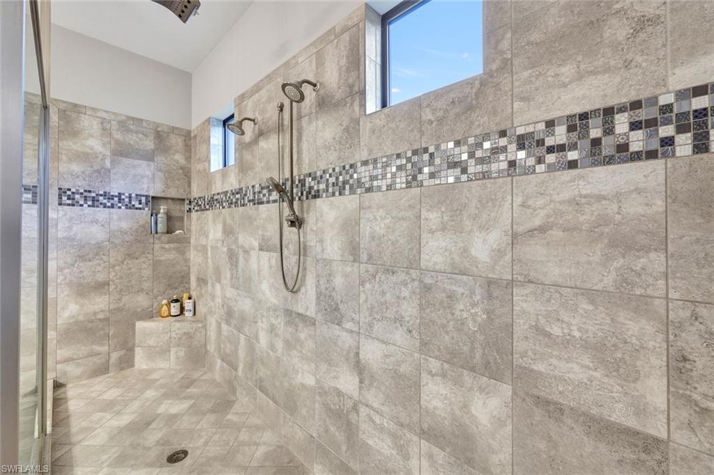 10163 Coconut Road Estero, FL 34135 - Photo 22 of 44 a bathroom with a shower