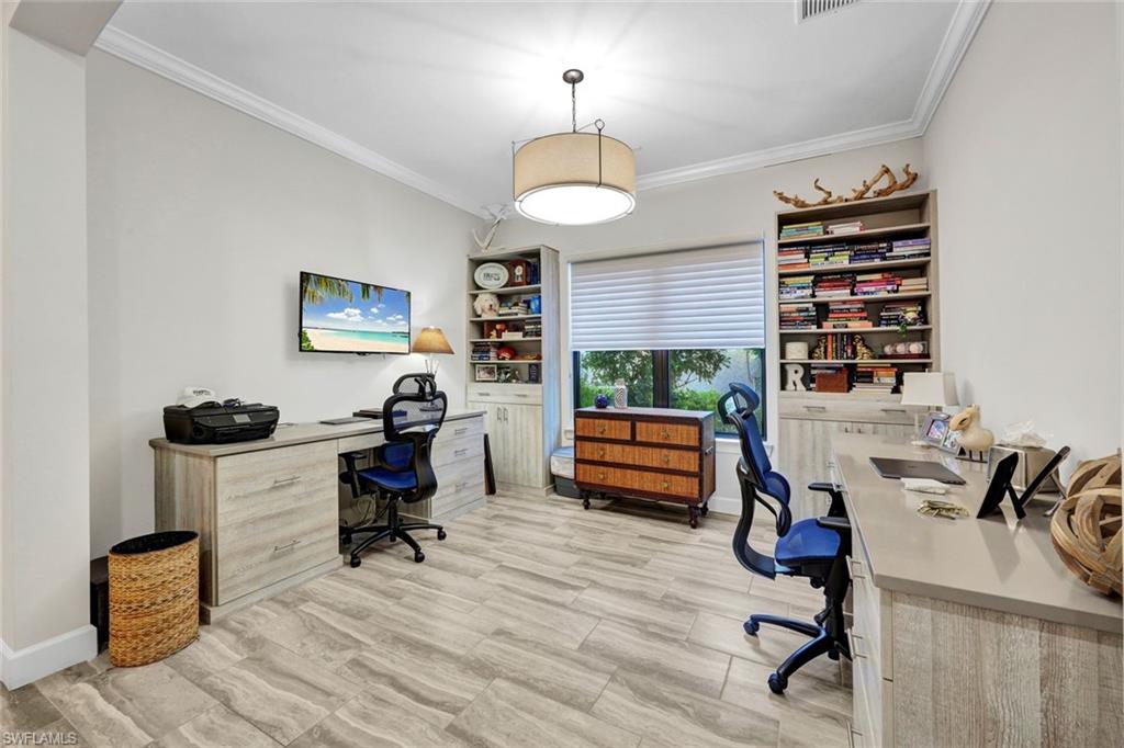 10163 Coconut Road Estero, FL 34135 - Photo 28 of 44 a view of a workspace with furniture and a window