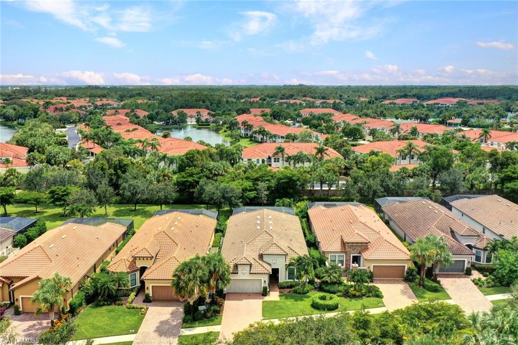 10163 Coconut Road Estero, FL 34135 - Photo 2 of 44 an aerial view of a house with outdoor space and street view