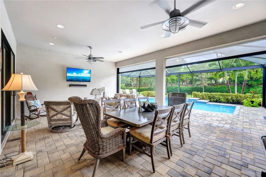 10163 Coconut Road Estero, FL 34135 - Photo 30 of 44 a view of a dining room with furniture window and outside view