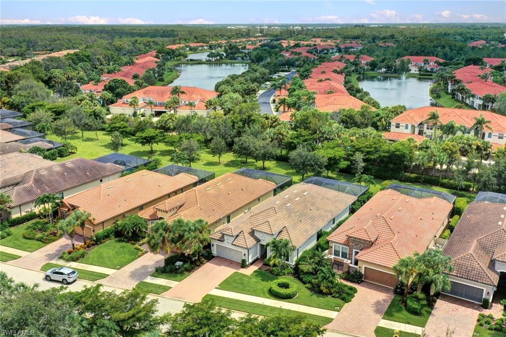 10163 Coconut Road Estero, FL 34135 - Photo 3 of 44 an aerial view of residential houses with outdoor space and river