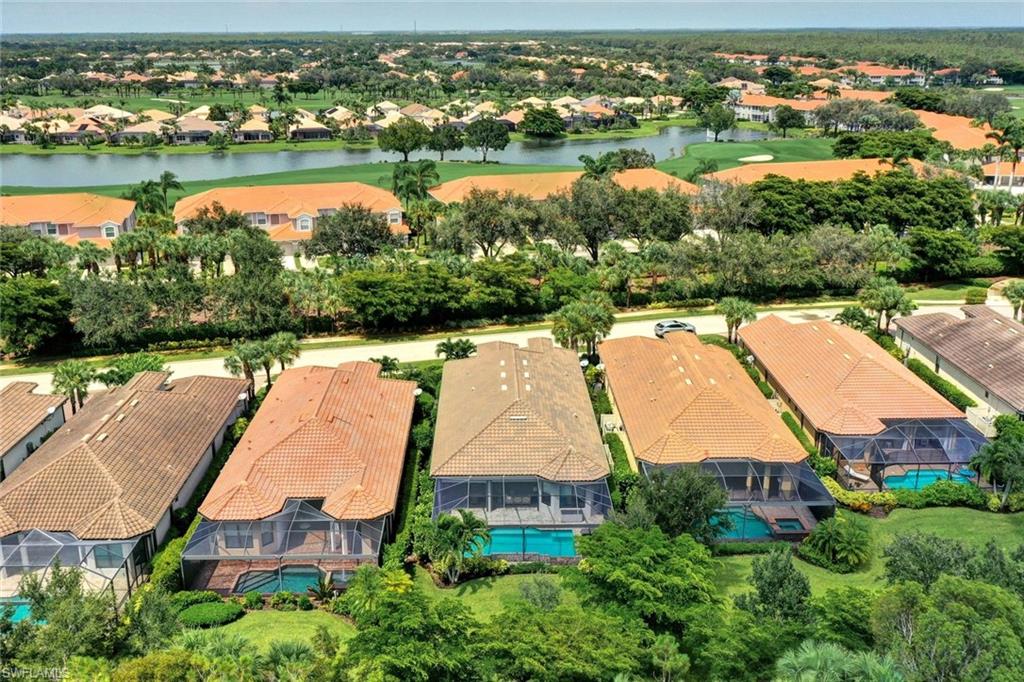 10163 Coconut Road Estero, FL 34135 - Photo 41 of 44 an aerial view of residential houses with outdoor space and lake view