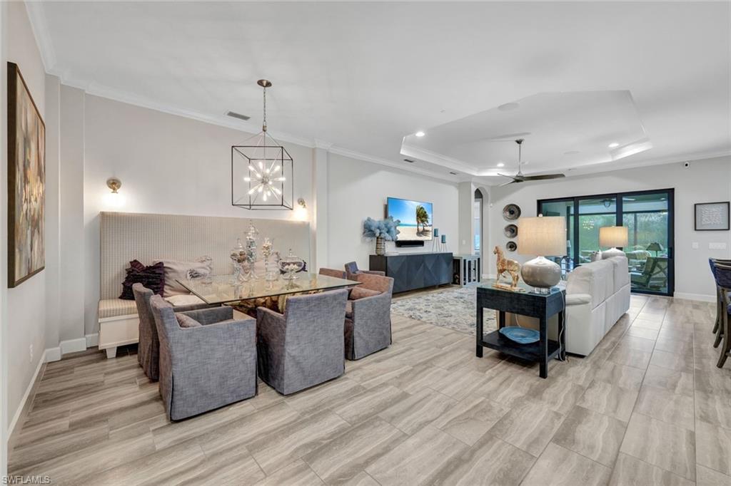 10163 Coconut Road Estero, FL 34135 - Photo 5 of 44 a living room with furniture and a wooden floor