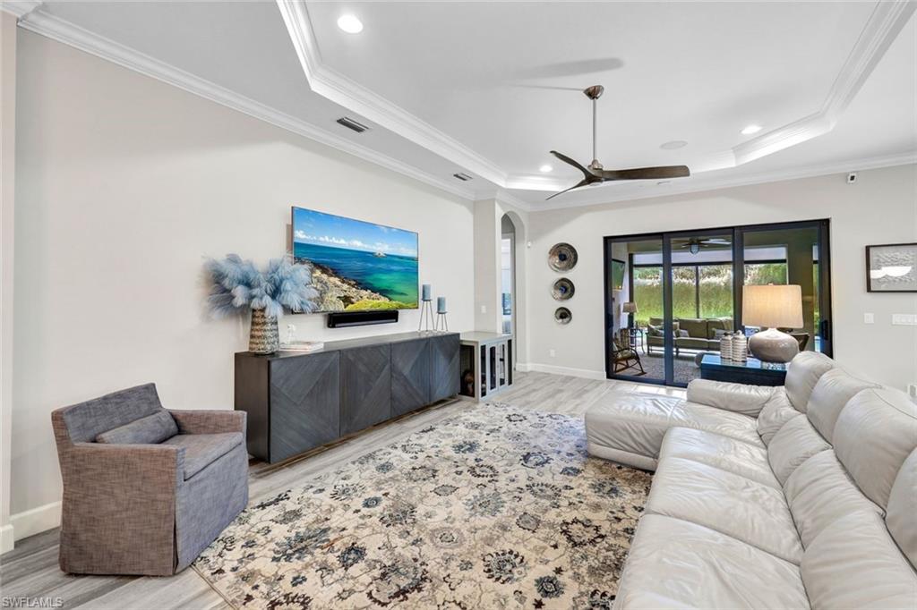 10163 Coconut Road Estero, FL 34135 - Photo 7 of 44 a living room with furniture and a large window