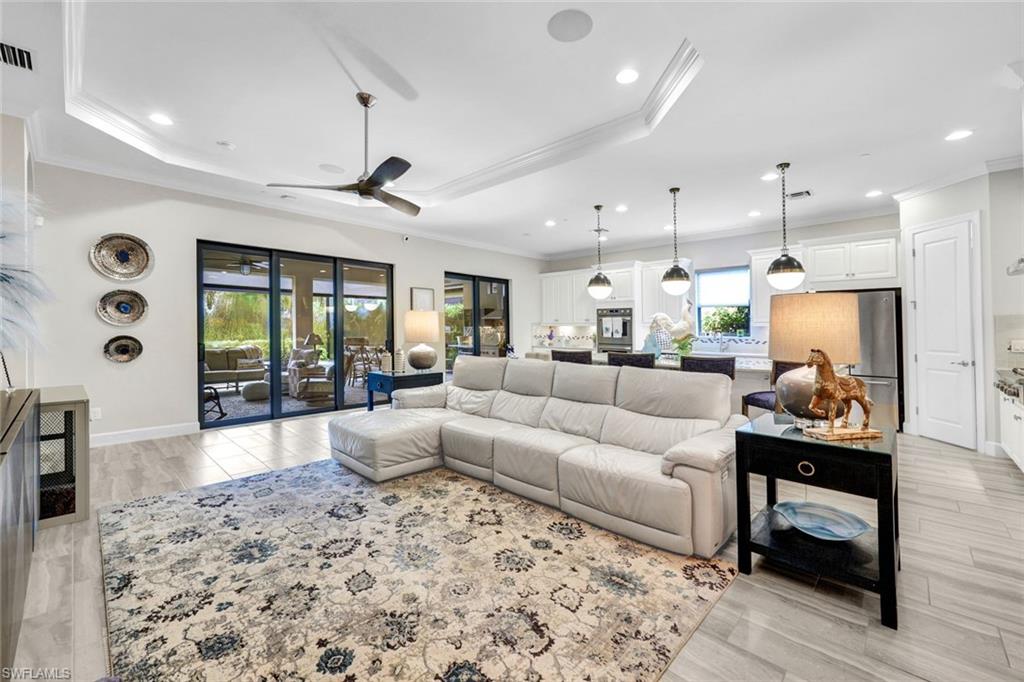 10163 Coconut Road Estero, FL 34135 - Photo 8 of 44 a living room with furniture and wooden floor