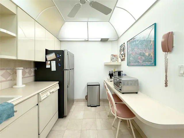a kitchen with a sink and refrigerator
