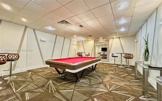 a room with table tennis table and windows