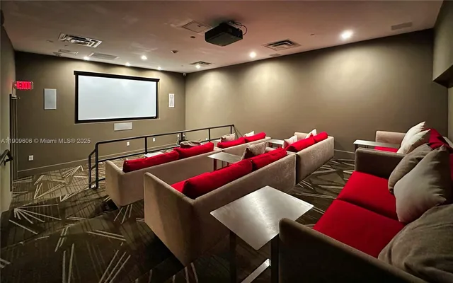 a view of a swimming pool and lounge chairs