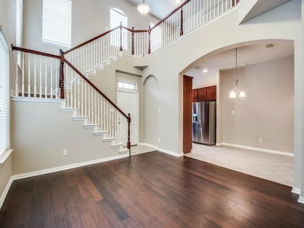 a view of an entryway with wooden floor