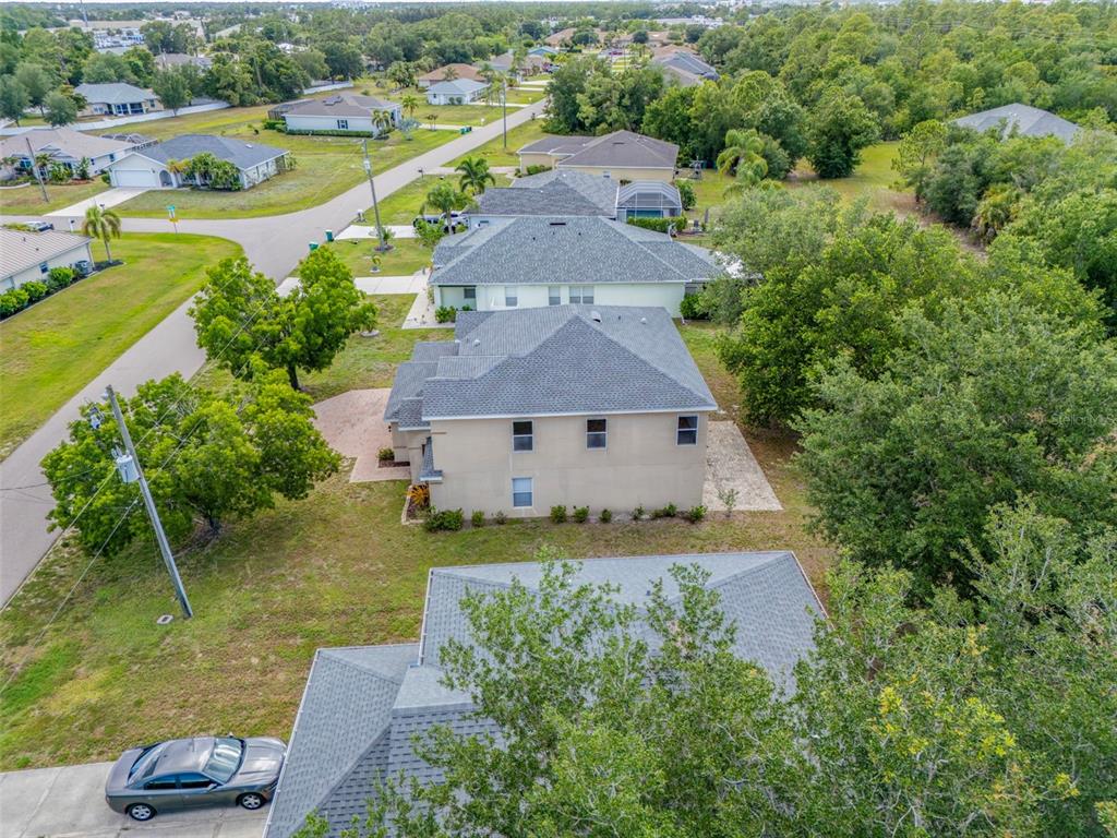 25134 Palisade Road Punta Gorda, FL 33983 - Photo 54 of 58 an aerial view of a house with a garden and lake view