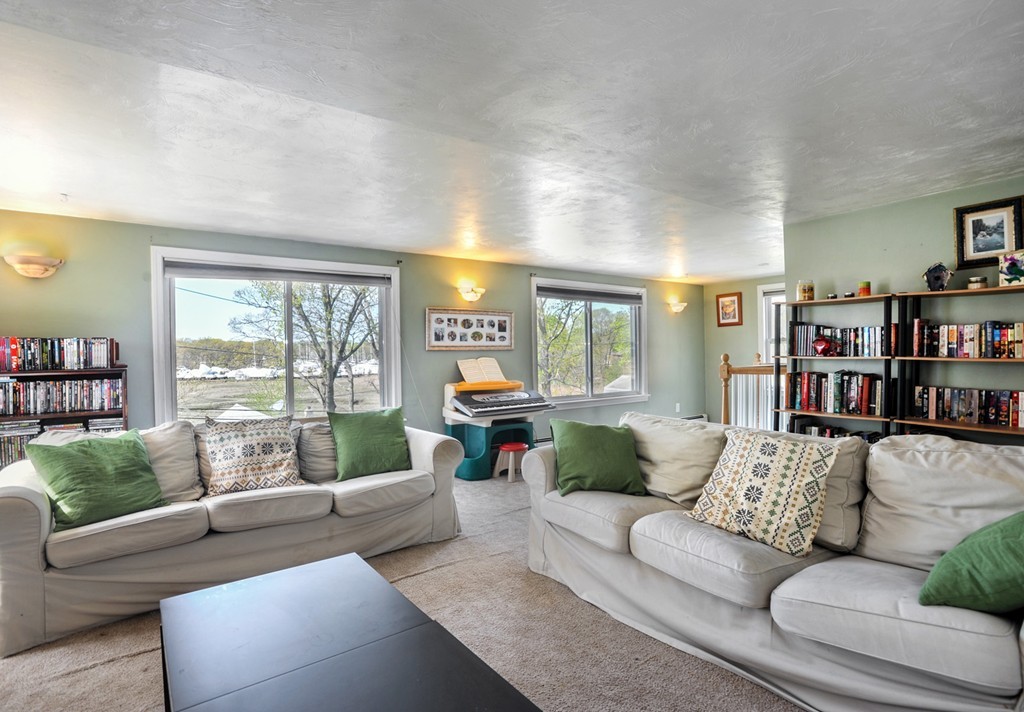 32 Colonial Road Weymouth, MA 02191 - Photo 11 of 19 a living room with furniture and a large window