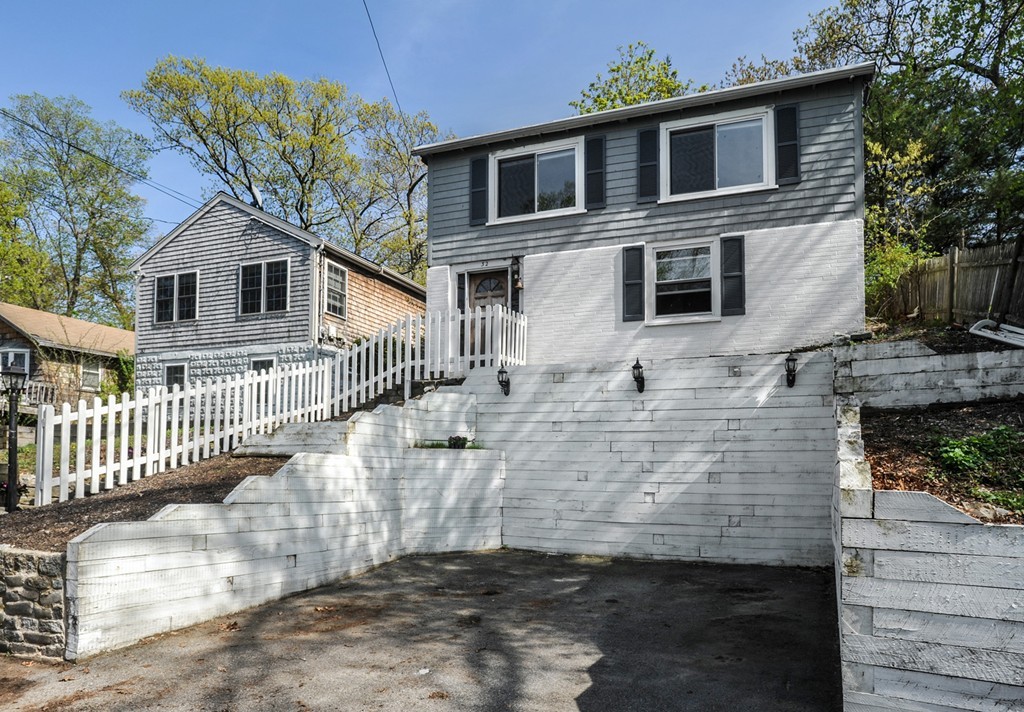 32 Colonial Road Weymouth, MA 02191 - Photo 3 of 19 a front view of a house with a yard