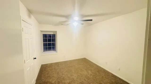 a view of a hallway with a wooden floor
