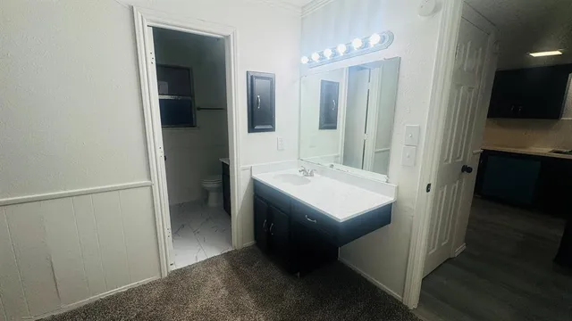 a view of a small yard with wooden fence